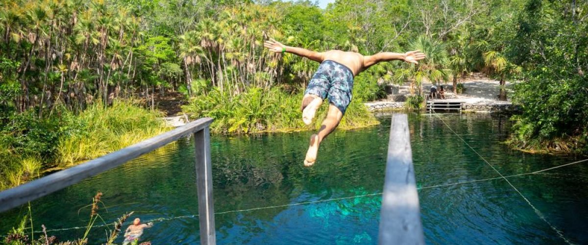 Man,Diving,In,Cenote,Escondido,In,Riviera,Maya,Mexico